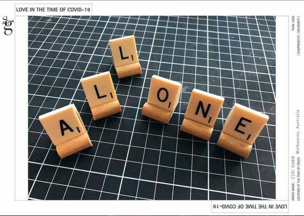 Six scrabble tiles arranged on a dark green with white lines cutting surface. The scrabble tiles read 'all one' 