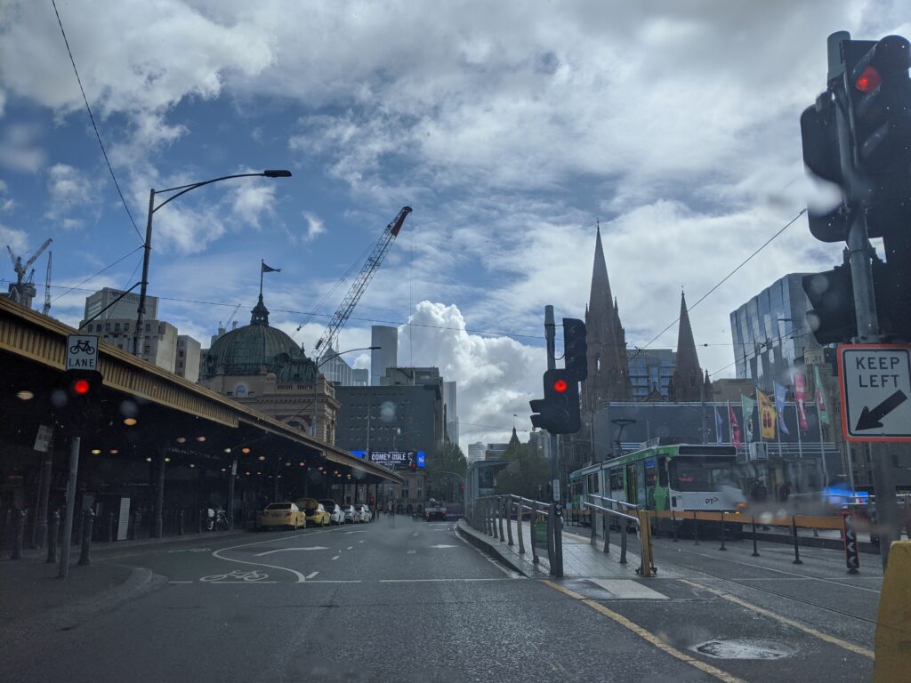 An empty Melbourne CBD from Flinders Street Station looking towards the skyscrapers